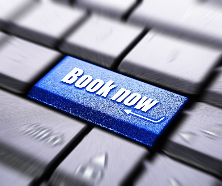 A blue keyboard key labeled Book Now.